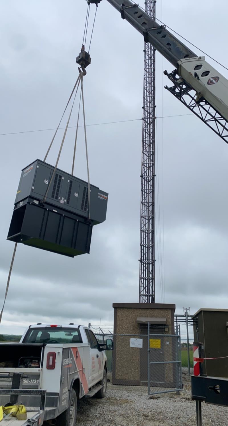 commercial generac generator on crane